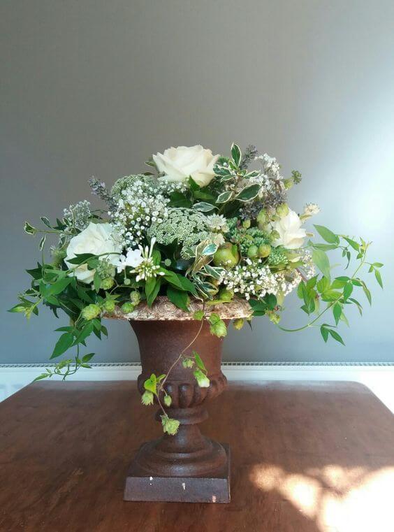 Cream top table centerpiece flower arrangement